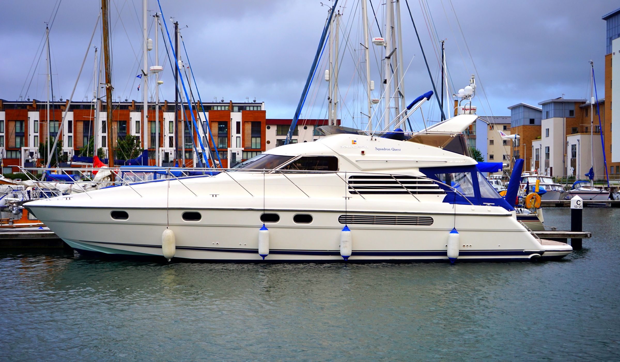 Yachts moored at a marina